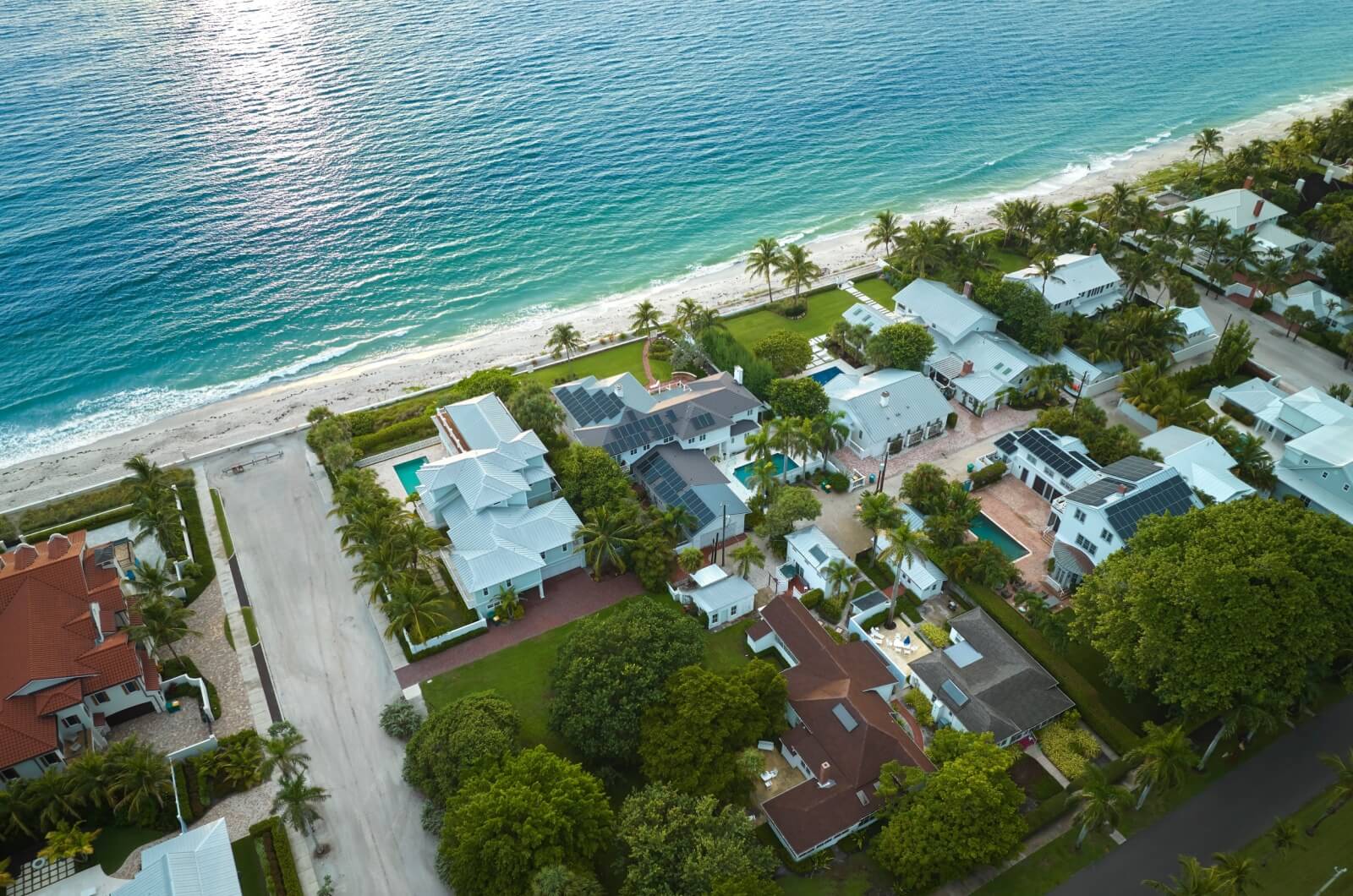 Aerial view of a lush, green, residential community on the ocean in Florida